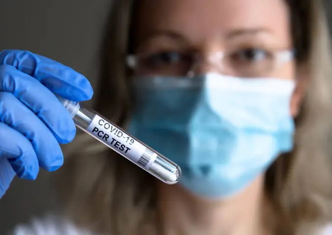 woman-holding-covid-test